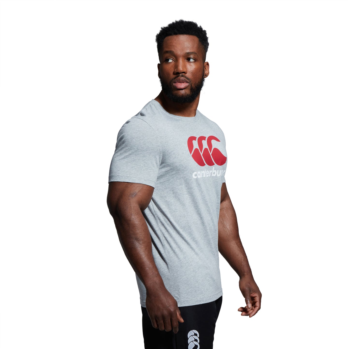 Male model wearing grey top from Canterbury clothing range