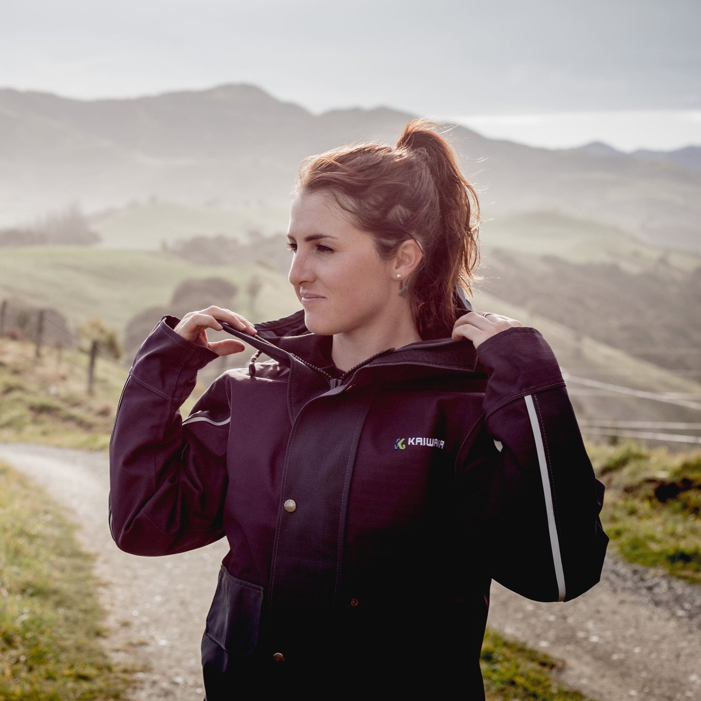 Women’s farm clothing in use: Kaiwaka Stormforce Winter Jacket, reliable farming waterproofs for harsh weather conditions.