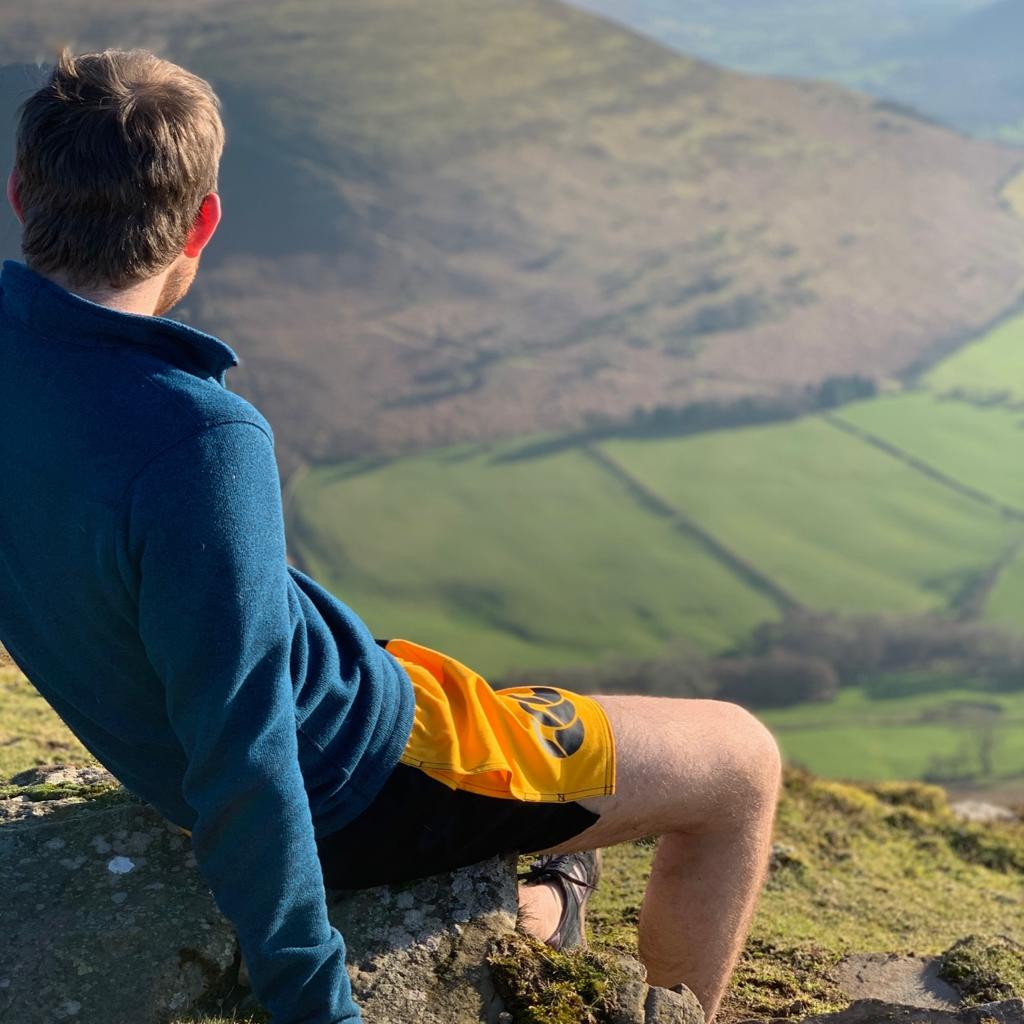 Hiker wearing the Canterbury clothing New Zealand brand and sitting on a rock