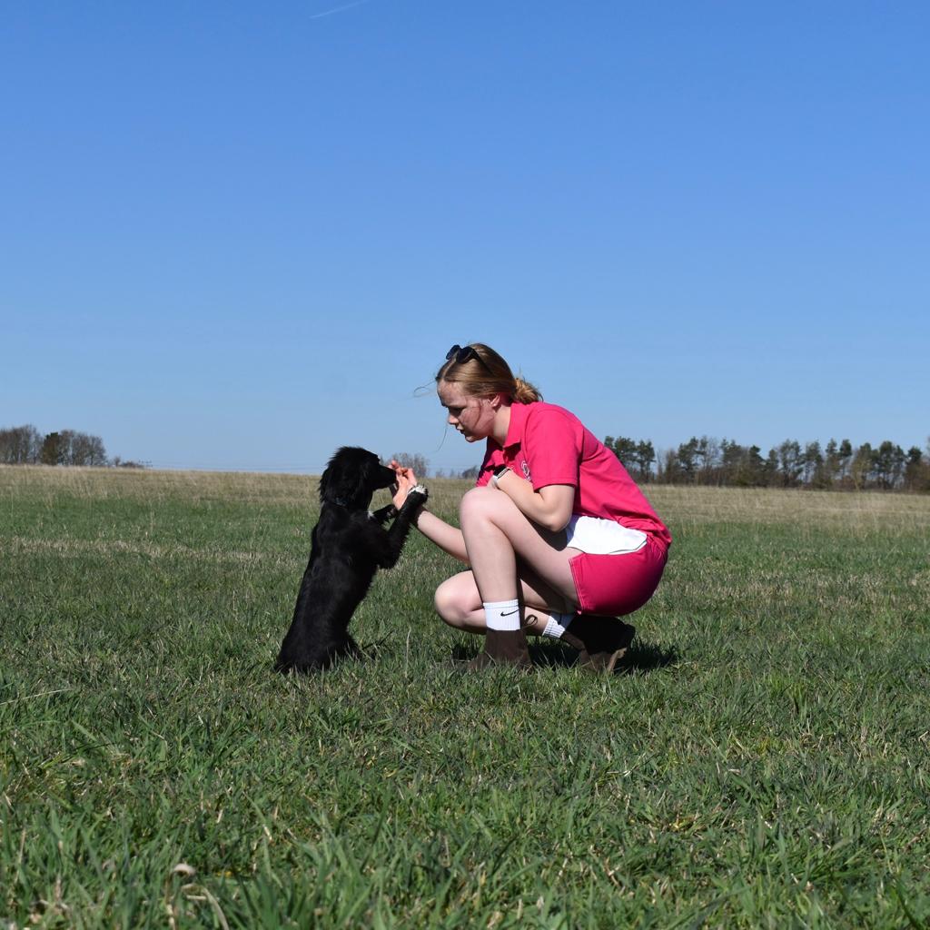 Woman wearing white and pink clothing for farmers