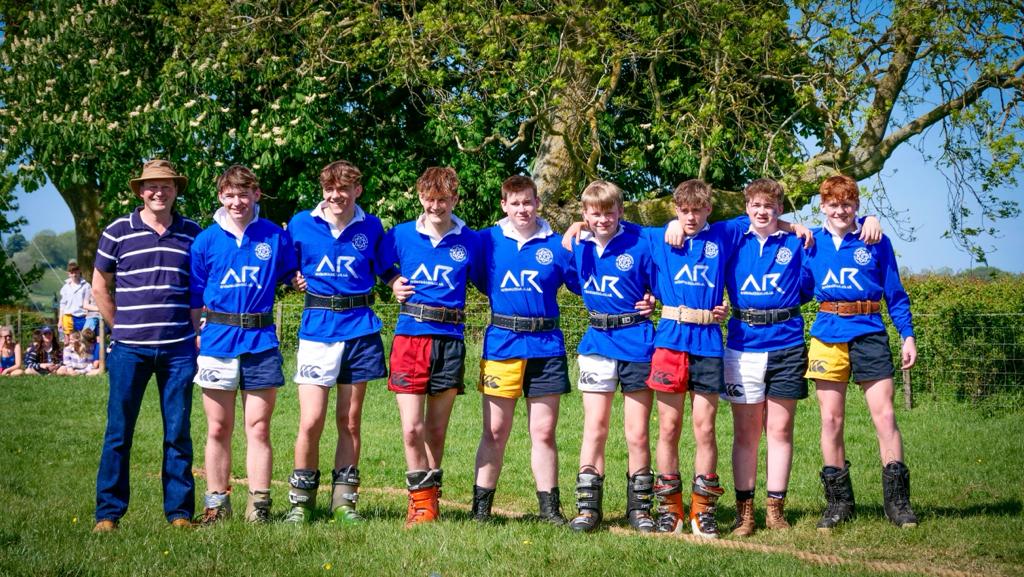A team of rugby players wearing Canterbury harlequin shorts in several colours