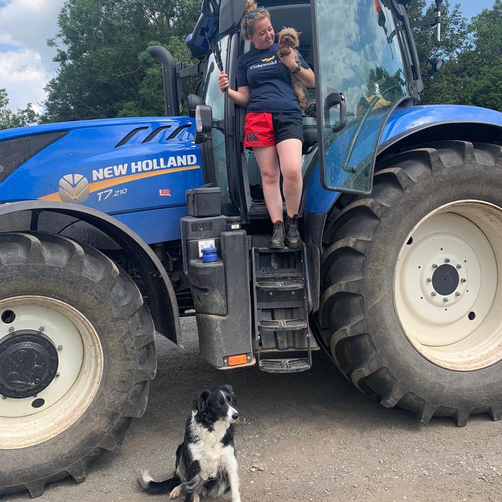 Tractor driver wearing harlequin rugby clothing