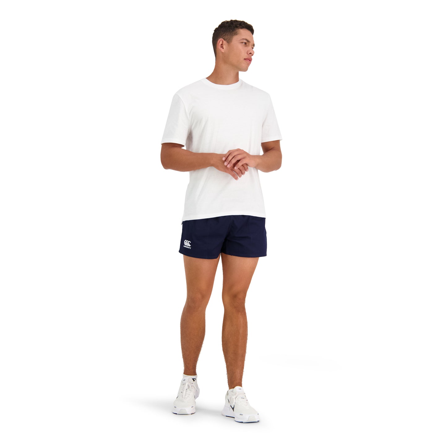 Model wearing Canterbury navy rugby shorts and white shirt