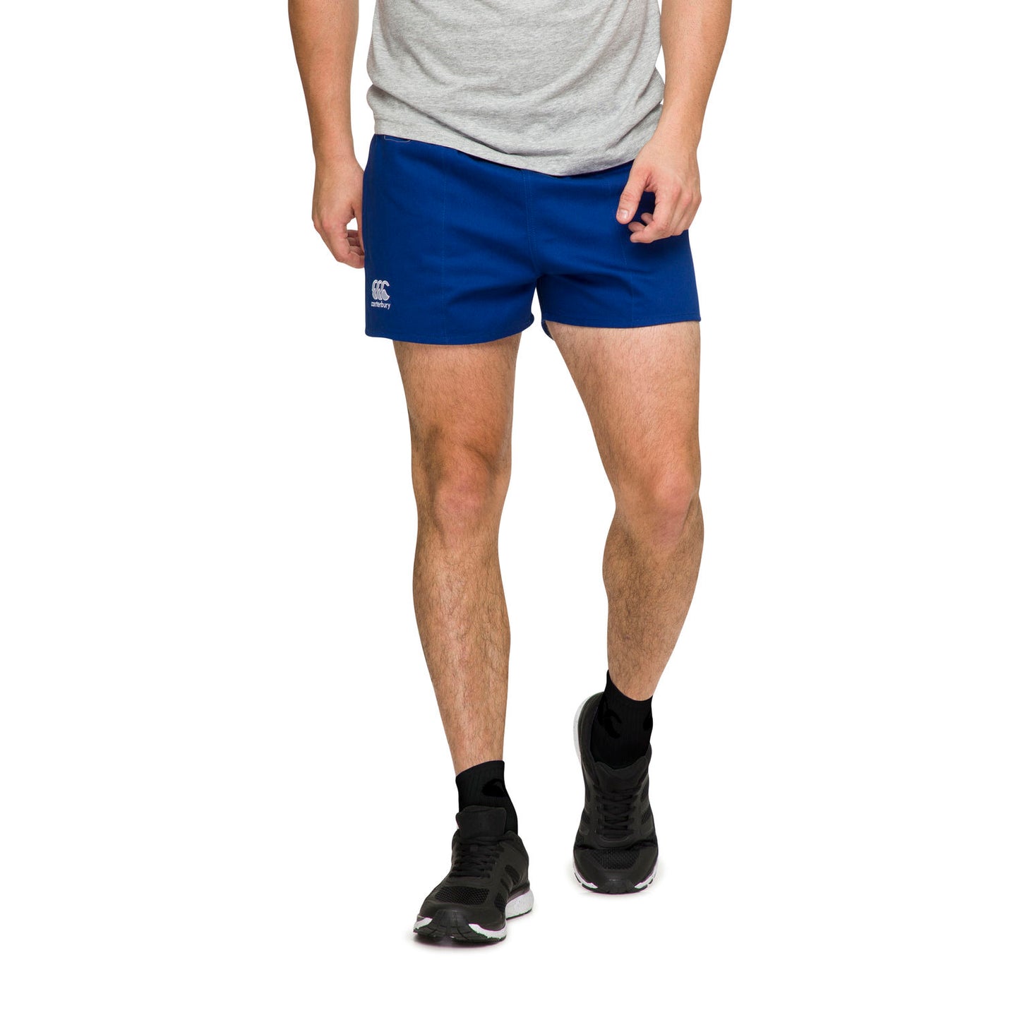 Man wearing royal blue Canterbury shorts and walking forwards