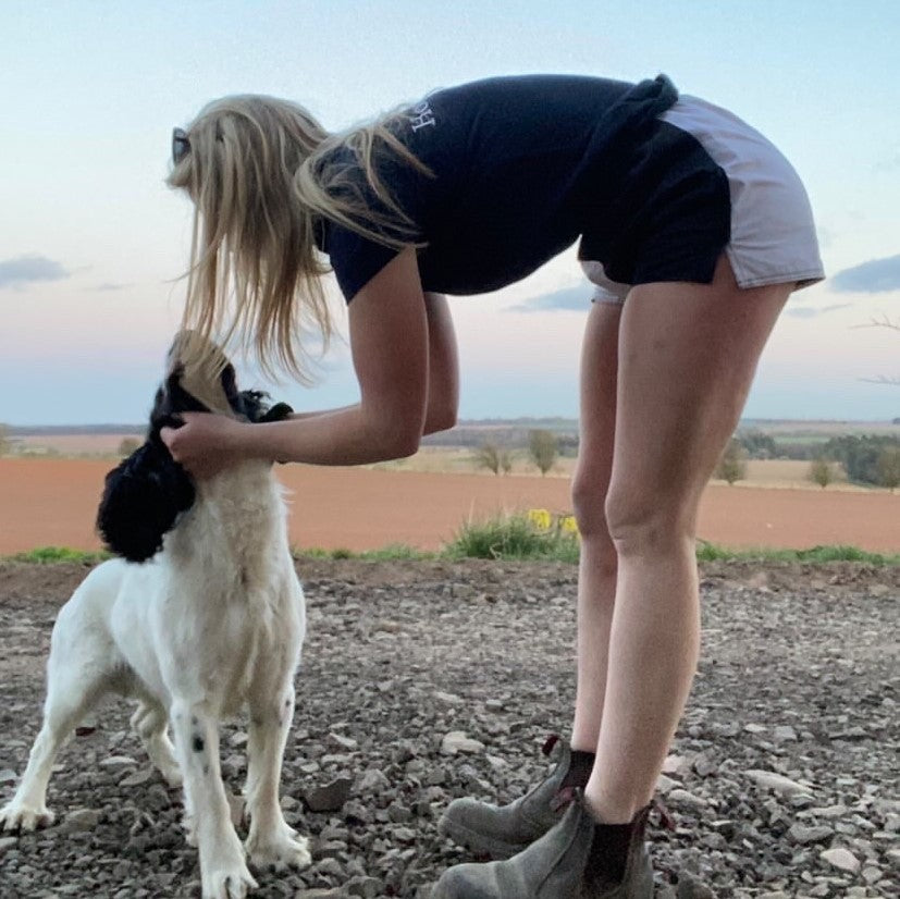 Dog handler wearing Canterbury rugby shorts with pockets