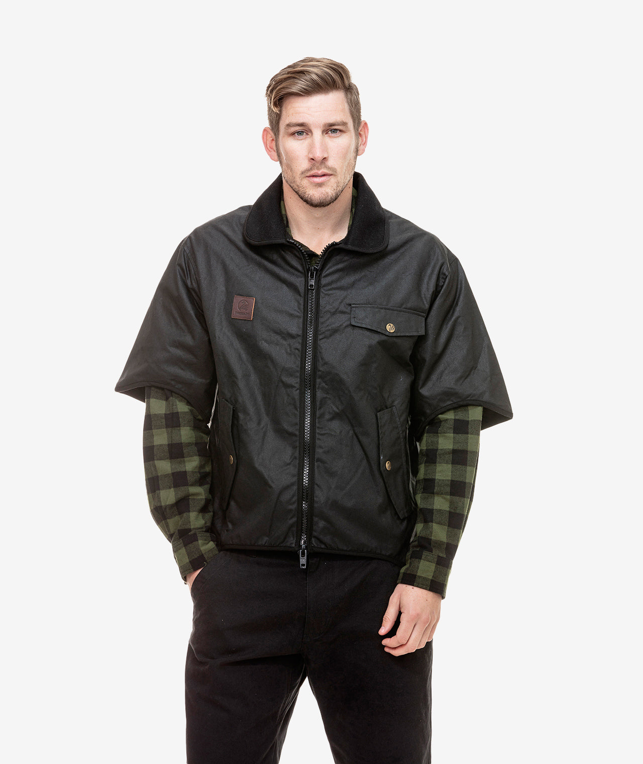 Model wearing oilskin jacket and a checkered shirt underneath