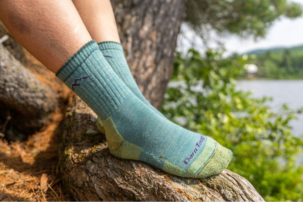 Ladies merino wool socks in aqua colour worn by a hiker
