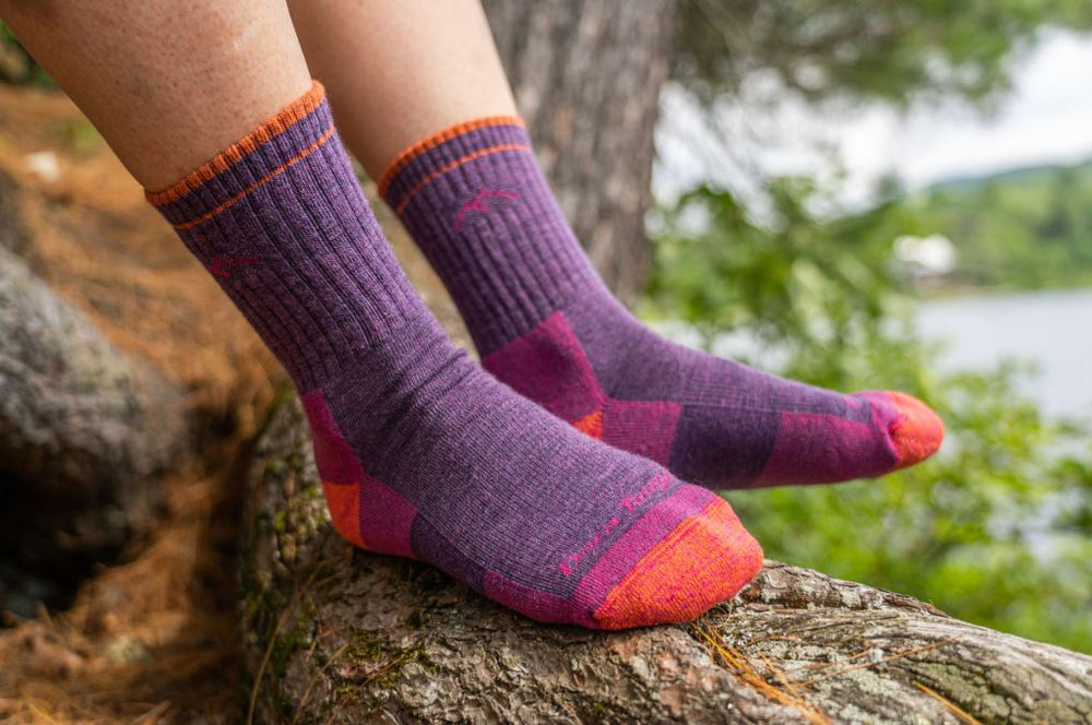 Plum heather Darn Tough hiking socks worn by a woman