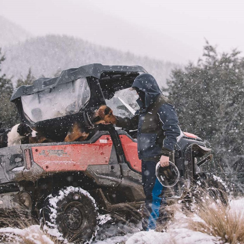 
                  
                    Male farmer working outdoors in Kaiwaka Men’s Stormforce Winter Jacket, waterproof farm jacket protection.
                  
                