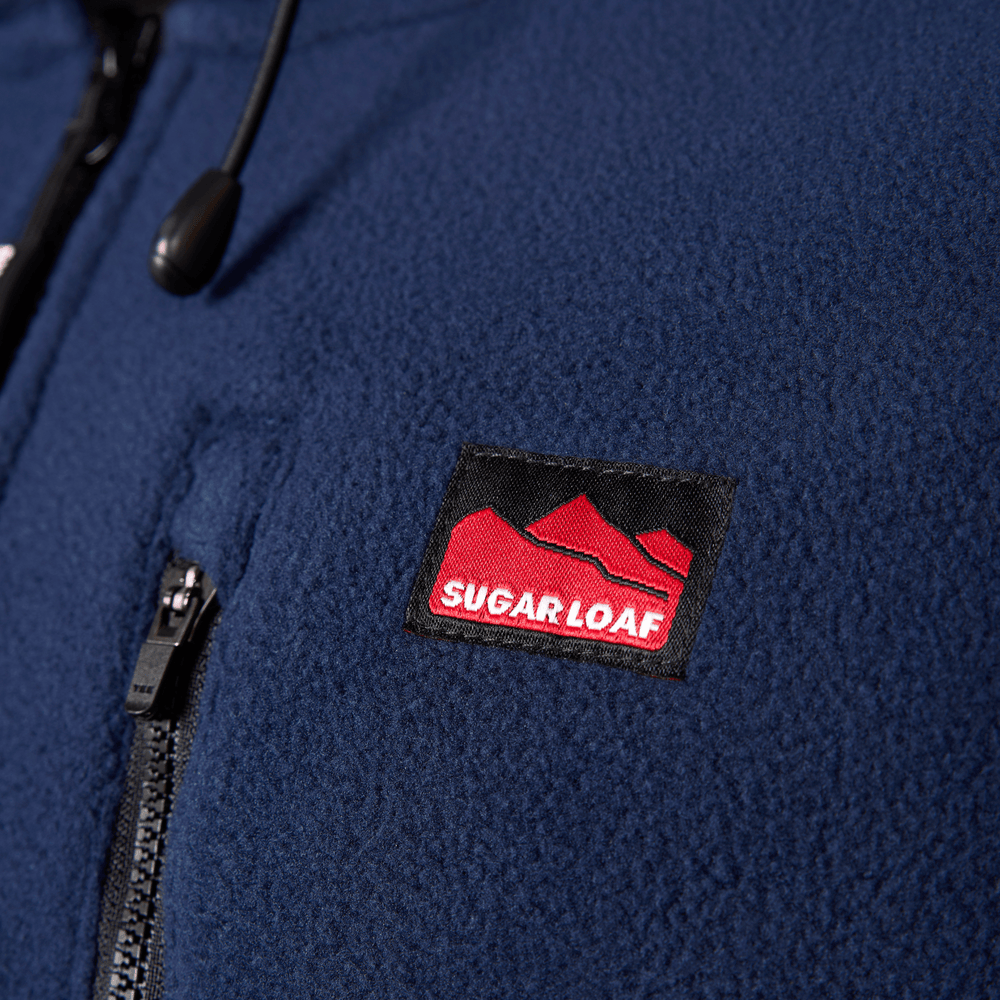 
                  
                    Detail shot of chest pocket on navy hooded fleece jumper, practical pocket storage for agricultural workwear.
                  
                