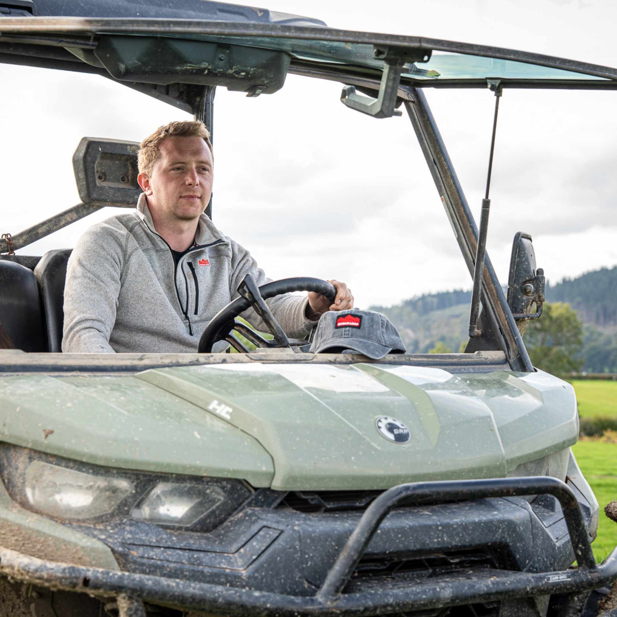 
                    
                      Farmer wearing Sugar Loaf Fell Half Zip Fleece in ash, rugged farm wear for outdoor work.
                    
                  