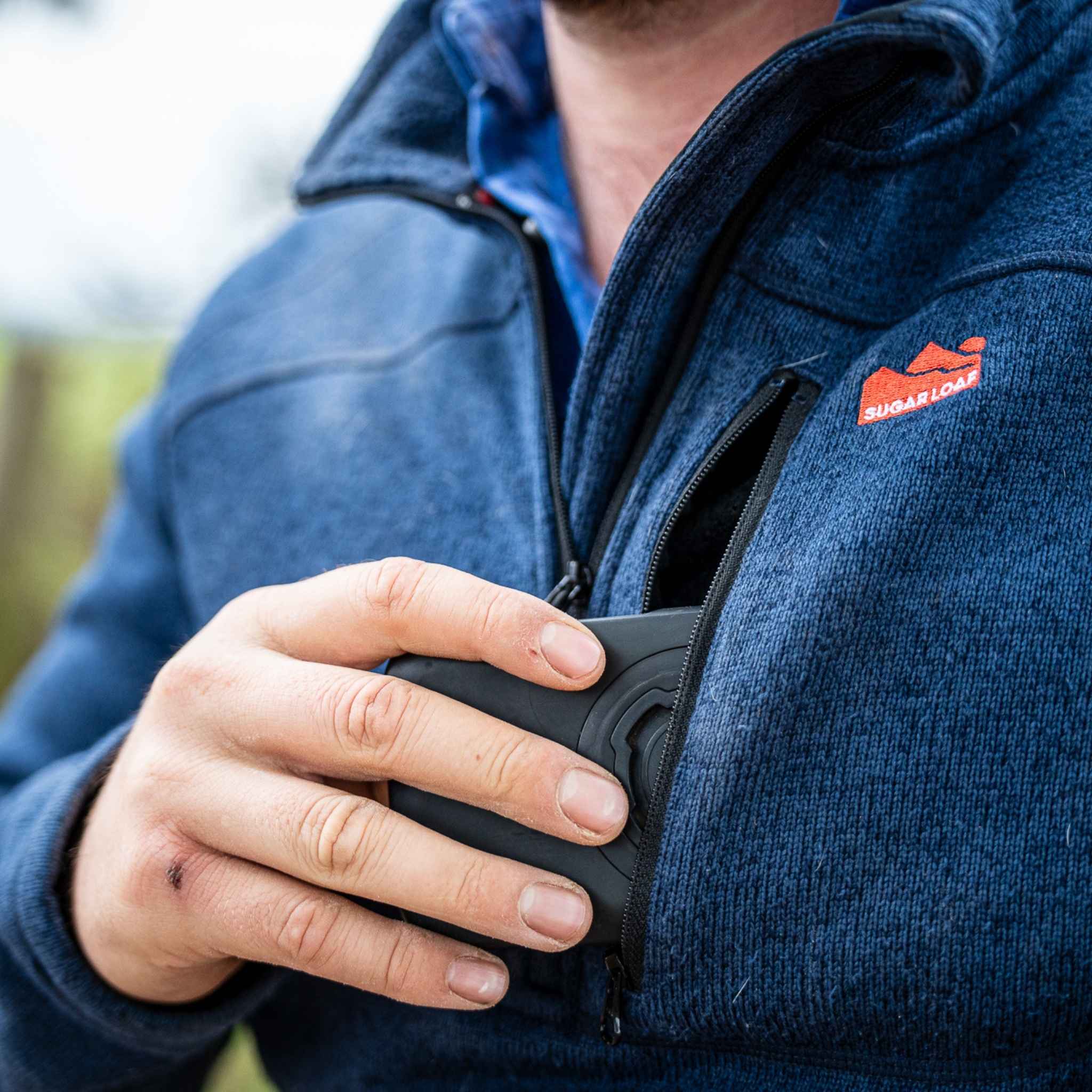 
                    
                      Close-up chest pocket detail of the Sugar Loaf Fell Half Zip Fleece navy, versatile navy work fleece for country work.
                    
                  
