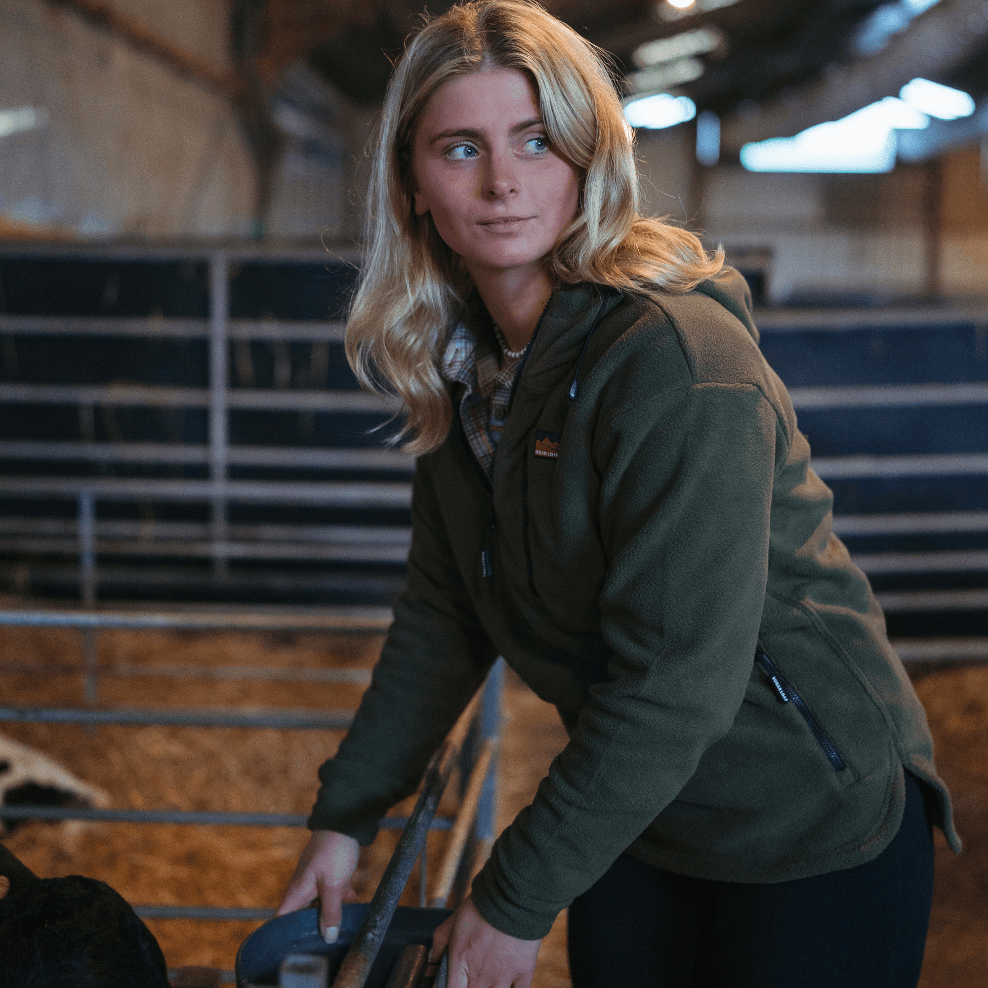 Sugar Loaf Shepherd Polar Fleece Hoodie in Khaki, a classic farming hoodie worn by a female farmer.