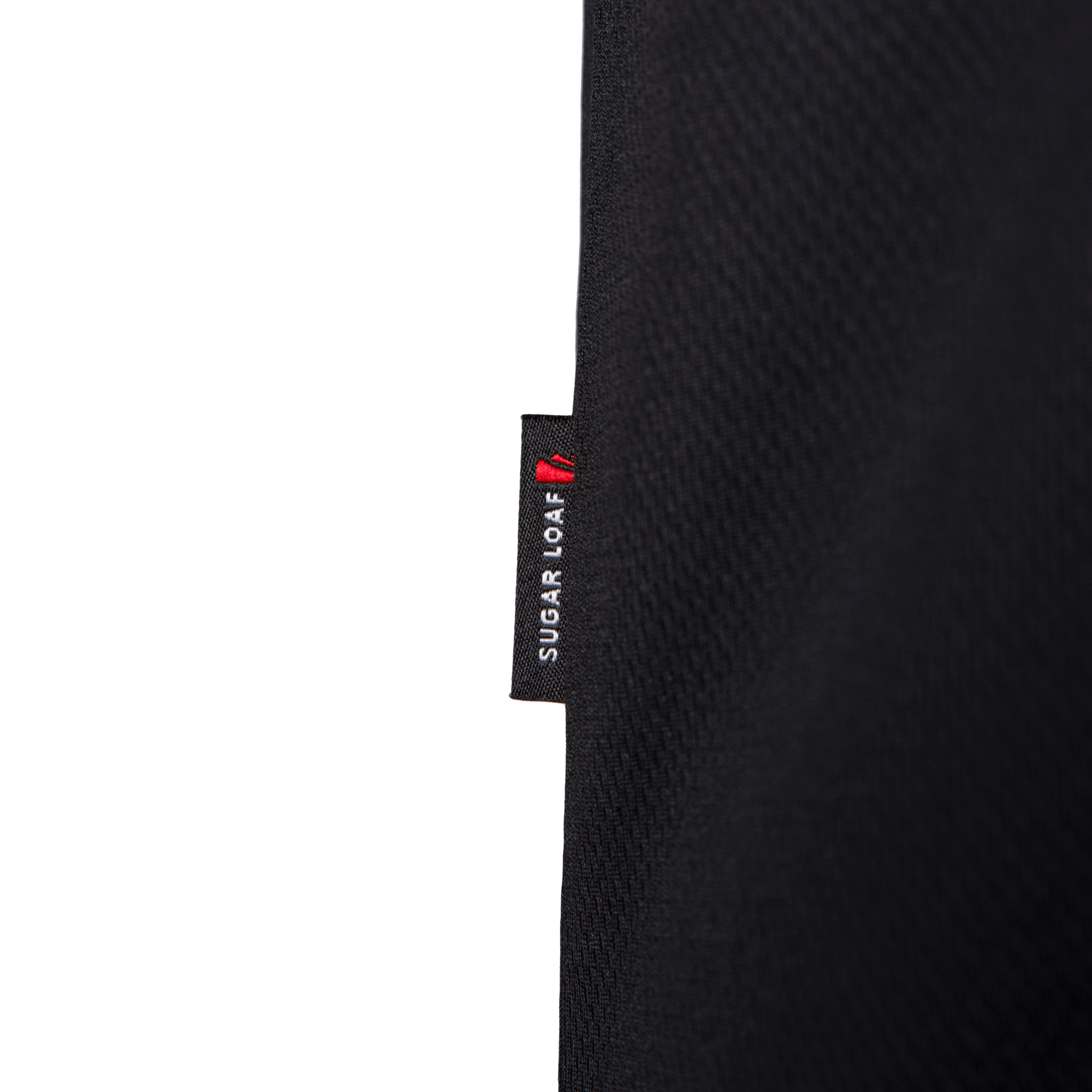 
                    
                      Close-up of branded side tab on Sugar Loaf shearing vest - high-quality shearing clothing and farming vest design.
                    
                  