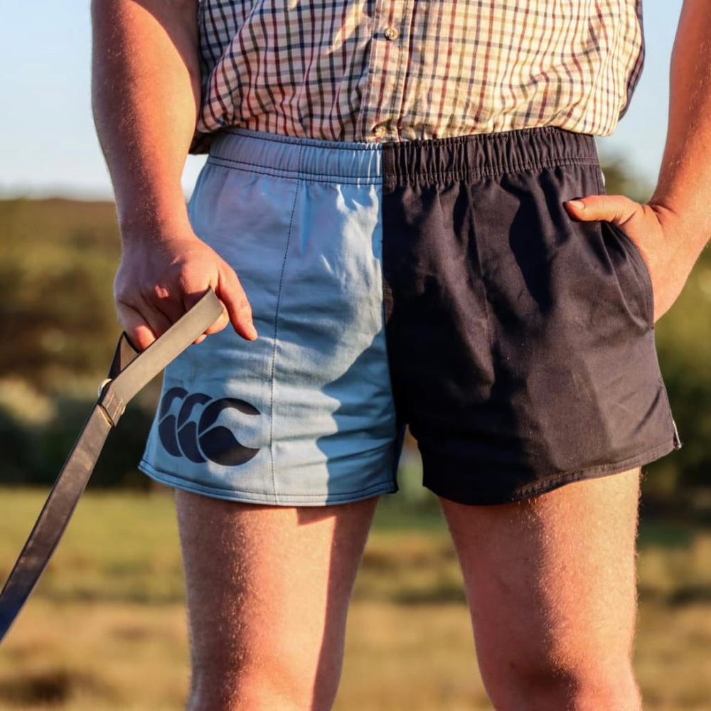 Cronulla and navy canterbury shorts worn by a farmer