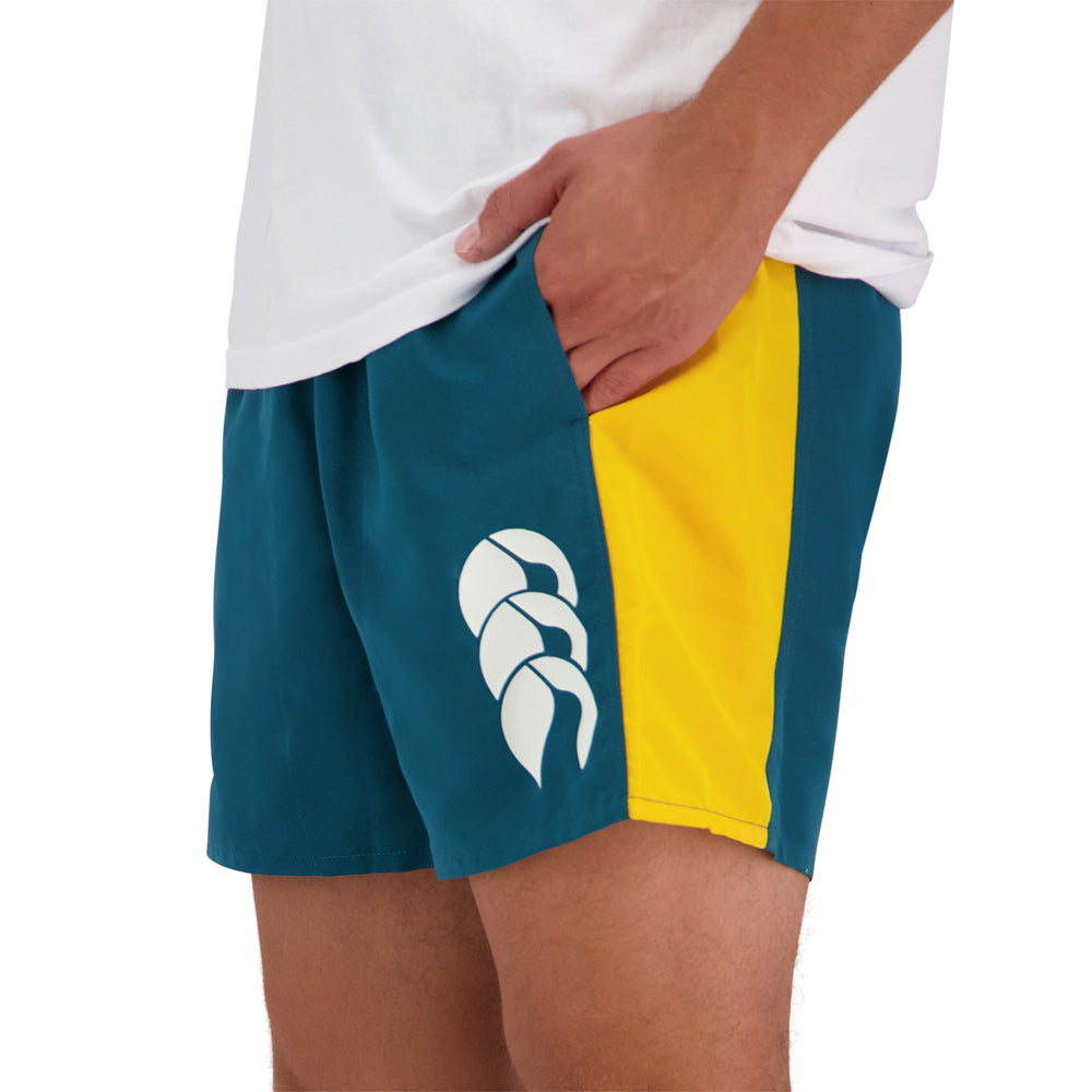 Teal CCC shorts with a yellow stripe down the side