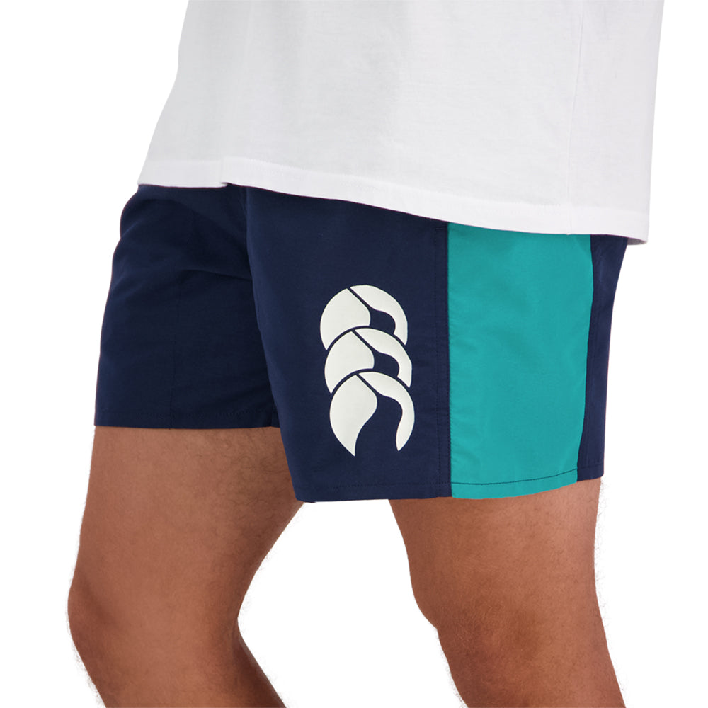 
                  
                    Navy Canterbury shorts with a teal stripe
                  
                