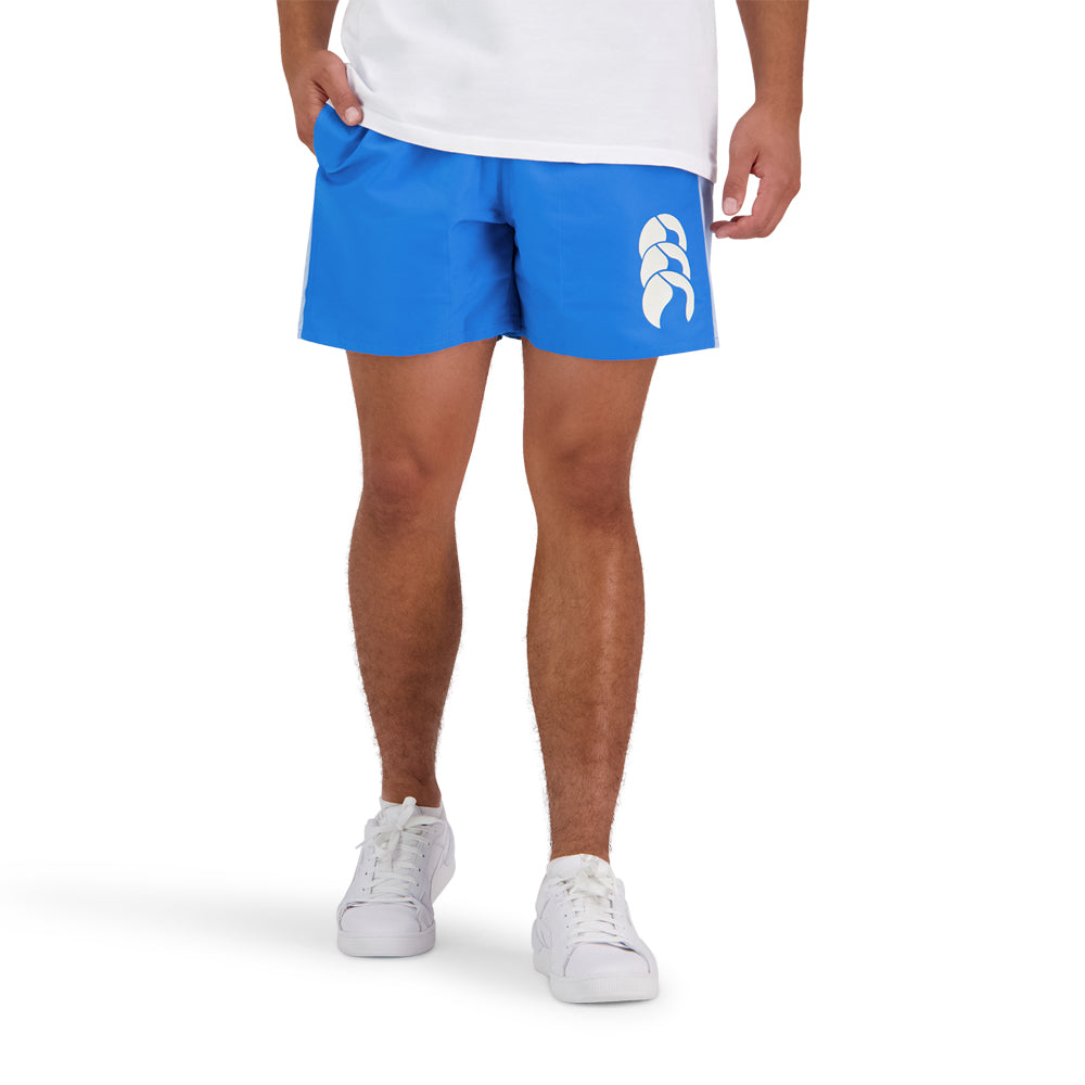 
                  
                    Man wearing blue CCC shorts
                  
                