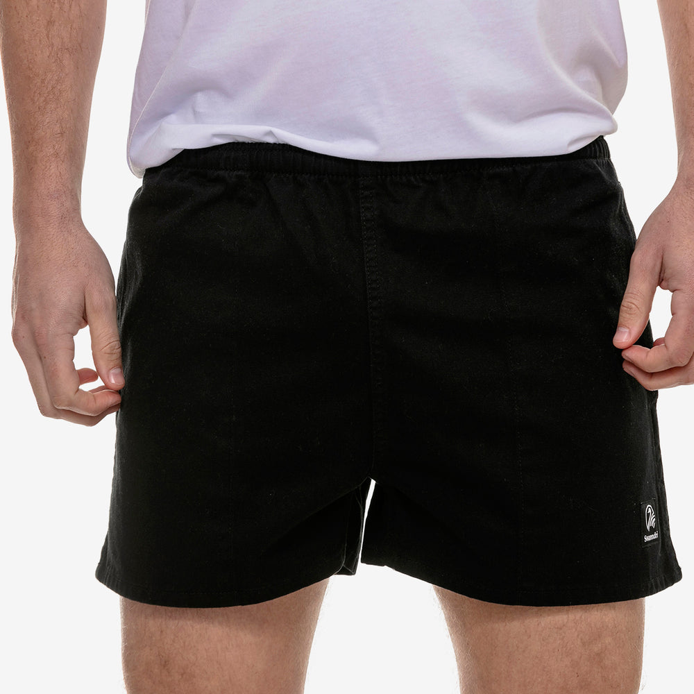 
                  
                    mens rugby shorts with pockets worn on someone's legs
                  
                