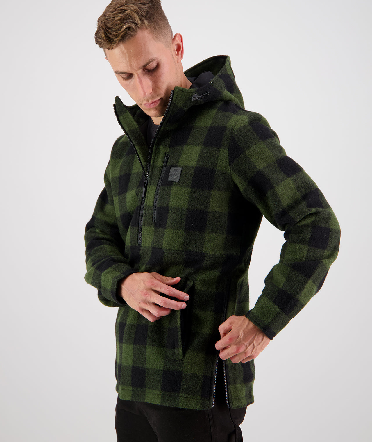 Person using the side zip on his farming hoodies